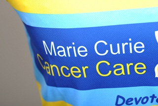 Yellow printed vests for Marie Curie - close up
